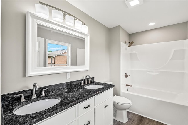 226 Elmwood Dr, Rock Island, TN 38581 - full bathroom featuring wood finished floors, double vanity, and shower / washtub combination