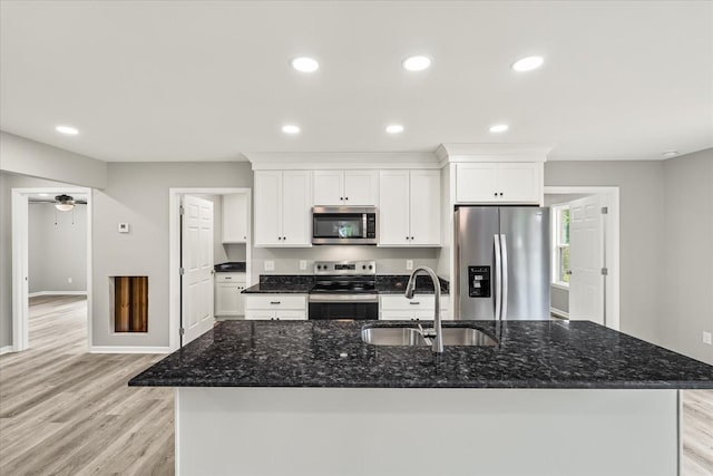 226 Elmwood Dr, Rock Island, TN 38581 - kitchen featuring stainless steel appliances, a kitchen island with sink, white cabinetry, light wood finished floors, and recessed lighting