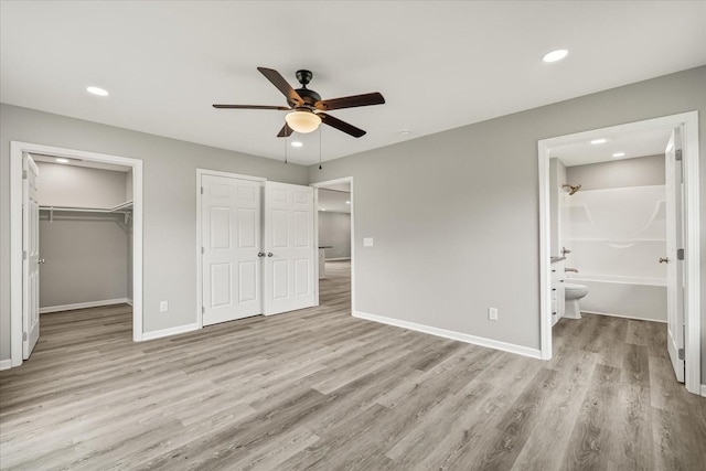 226 Elmwood Dr, Rock Island, TN 38581 - unfurnished bedroom with light wood-style flooring, recessed lighting, connected bathroom, and ceiling fan