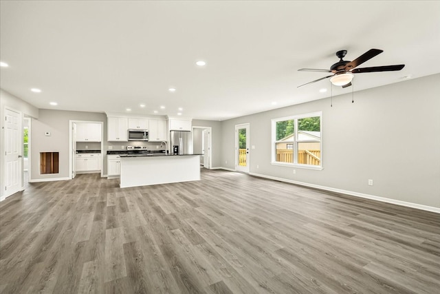 226 Elmwood Dr, Rock Island, TN 38581 - unfurnished living room featuring recessed lighting, wood finished floors, and a ceiling fan