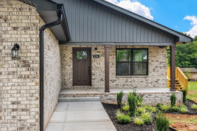 226 Elmwood Dr, Rock Island, TN 38581 - doorway to property with a porch and board and batten siding