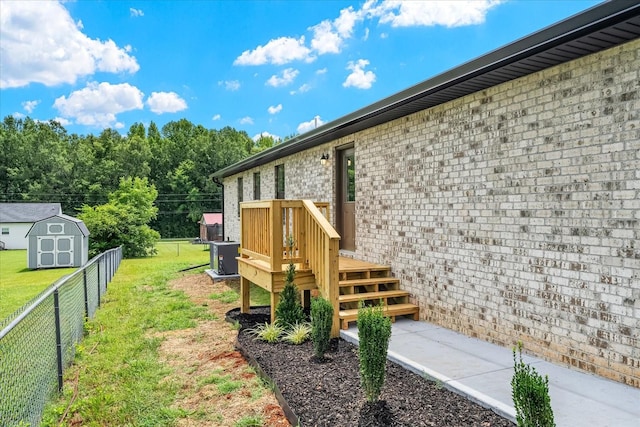 226 Elmwood Dr, Rock Island, TN 38581 - fenced backyard featuring a storage unit and a deck