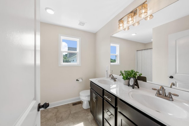 76 W High St, Clarksville, TN 37040 - full bathroom featuring double vanity and toilet