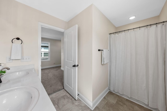76 W High St, Clarksville, TN 37040 - bathroom with double vanity and curtained shower