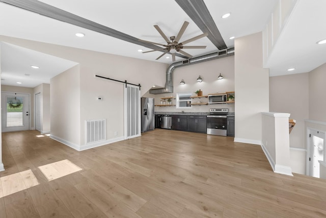 76 W High St, Clarksville, TN 37040 - unfurnished living room with a barn door, a ceiling fan, light wood-style flooring, recessed lighting, and beam ceiling