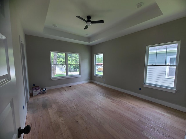 4211 Woods St, Old Hickory, TN 37138 - unfurnished room featuring a tray ceiling, light wood-style floors, and ceiling fan