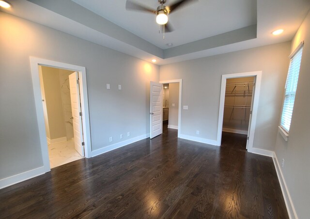 4211 Woods St, Old Hickory, TN 37138 - unfurnished bedroom featuring dark wood-style floors, a spacious closet, recessed lighting, ensuite bath, and a closet