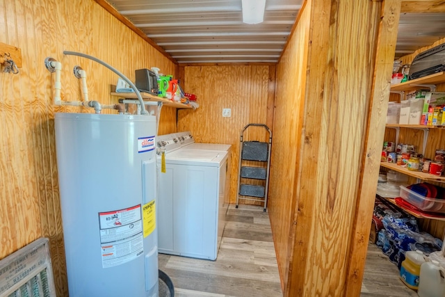 357 Providence Rd, Pulaski, TN 38478 - laundry room with electric water heater, wood finished floors, washer and dryer, and wooden walls