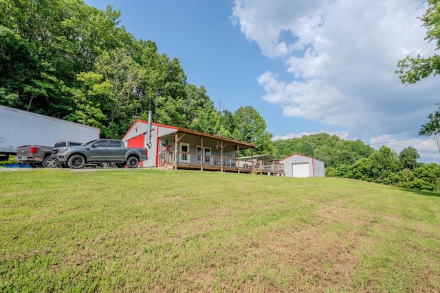 357 Providence Rd, Pulaski, TN 38478 - view of green lawn featuring a detached garage and an outbuilding