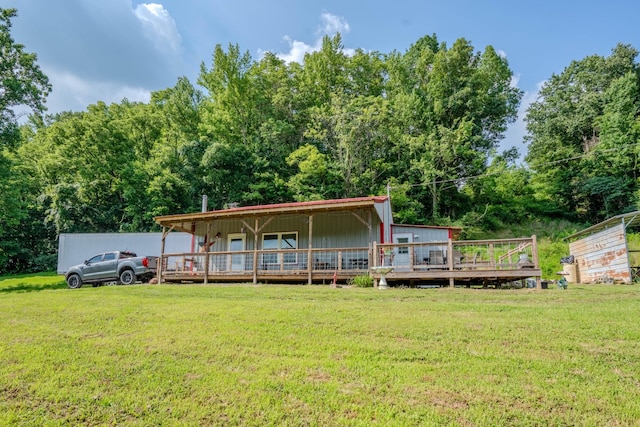 357 Providence Rd, Pulaski, TN 38478 - rear view of house featuring a lawn, a wooden deck, and board and batten siding
