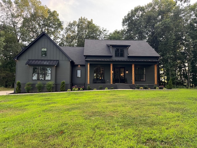 8921 Cedar Grove Rd, Cross Plains, TN 37049 - modern farmhouse featuring board and batten siding, a porch, a front yard, and a shingled roof