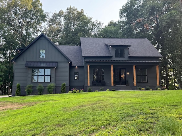 8921 Cedar Grove Rd, Cross Plains, TN 37049 - modern farmhouse style home featuring a porch, a front lawn, board and batten siding, and roof with shingles