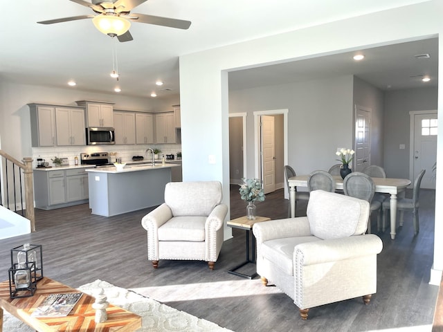 564 Twyla Dr, Lebanon, TN 37087 - living area featuring wood finished floors, a ceiling fan, recessed lighting, and stairway