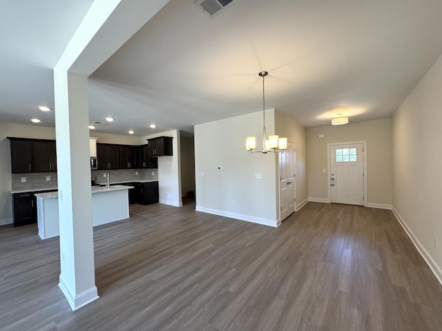 564 Twyla Dr, Lebanon, TN 37087 - kitchen with a chandelier, backsplash, dark wood-style floors, recessed lighting, and light countertops