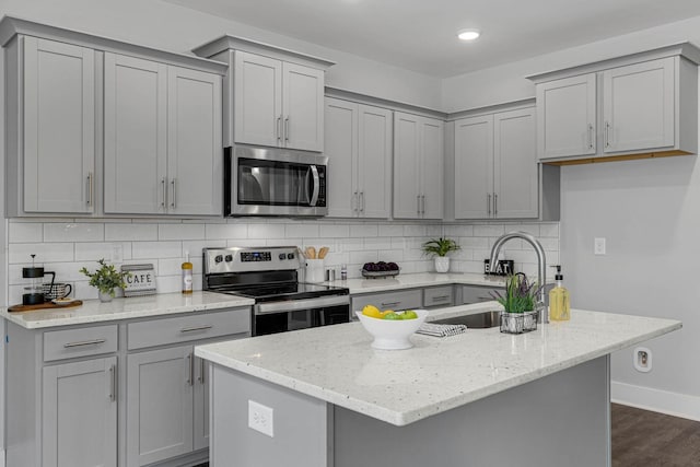 564 Twyla Dr, Lebanon, TN 37087 - kitchen featuring appliances with stainless steel finishes, gray cabinetry, decorative backsplash, and recessed lighting