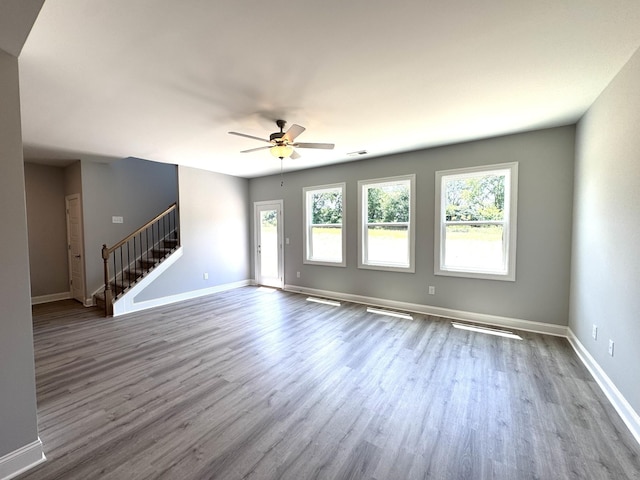 564 Twyla Dr, Lebanon, TN 37087 - unfurnished living room featuring wood finished floors, stairway, and ceiling fan