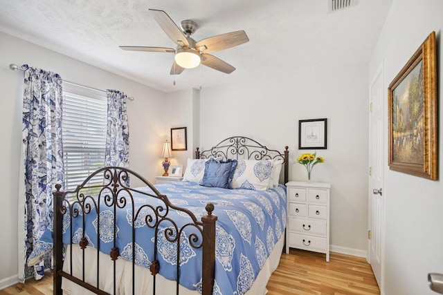 4858 Chelanie Cir, Murfreesboro, TN 37129 - bedroom with wood finished floors, ceiling fan, and a textured ceiling