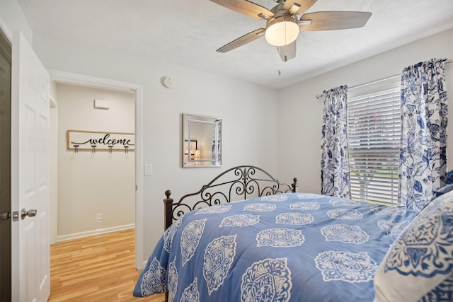 4858 Chelanie Cir, Murfreesboro, TN 37129 - bedroom featuring wood finished floors, a textured ceiling, and ceiling fan