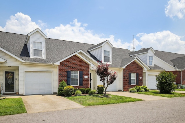 4858 Chelanie Cir, Murfreesboro, TN 37129 - view of front of home featuring concrete driveway, brick siding, and a shingled roof