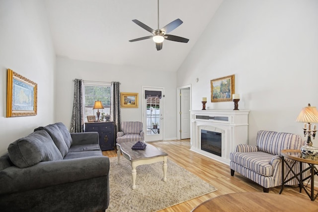 4858 Chelanie Cir, Murfreesboro, TN 37129 - living room with high vaulted ceiling, a ceiling fan, light wood-type flooring, and a glass covered fireplace