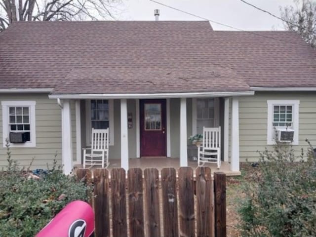 310 Hill St W, Waynesboro, TN 38485 - bungalow with a porch, a shingled roof, and cooling unit