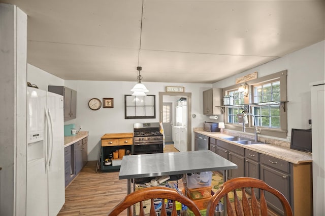 1509 5th Ave W, Springfield, TN 37172 - kitchen featuring appliances with stainless steel finishes, light wood-style flooring, light countertops, and gray cabinetry