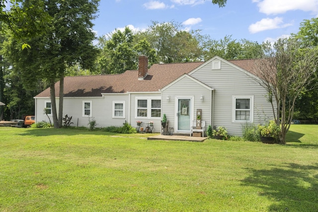 1509 5th Ave W, Springfield, TN 37172 - rear view of house with a yard, a chimney, and a shingled roof