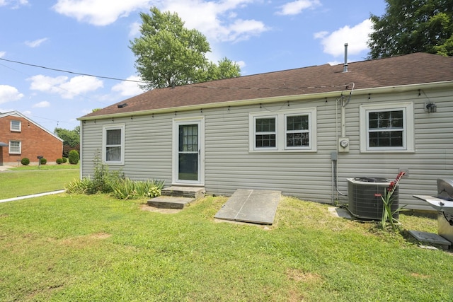 1509 5th Ave W, Springfield, TN 37172 - back of property featuring a lawn and roof with shingles