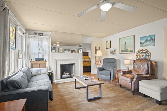 1509 5th Ave W, Springfield, TN 37172 - living room featuring a ceiling fan, light wood-style flooring, and a fireplace with flush hearth