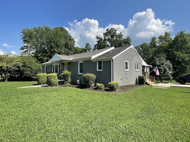 64 Mcdougal Rd, Fayetteville, TN 37334 - view of property exterior with a lawn and brick siding