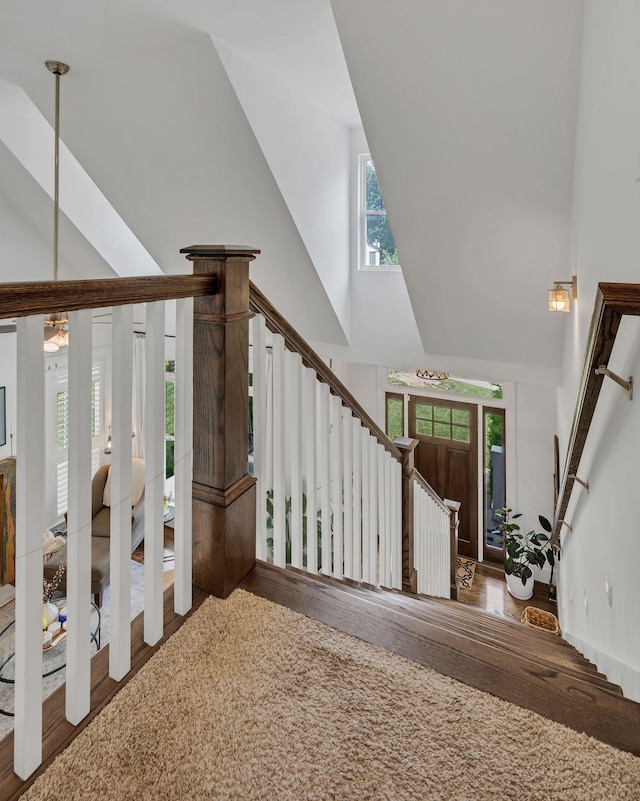 7106 Pepper Tree Cir, Fairview, TN 37062 - stairway with high vaulted ceiling and wood finished floors