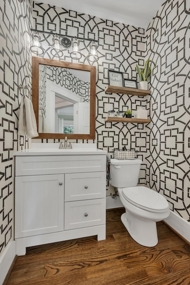 7106 Pepper Tree Cir, Fairview, TN 37062 - half bath featuring wallpapered walls, vanity, and wood finished floors