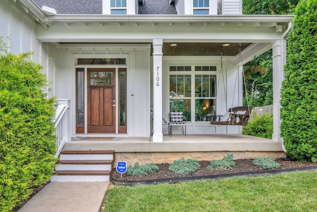7106 Pepper Tree Cir, Fairview, TN 37062 - view of exterior entry with covered porch and roof with shingles