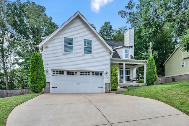 7106 Pepper Tree Cir, Fairview, TN 37062 - traditional home featuring covered porch, driveway, a garage, stone siding, and a chimney
