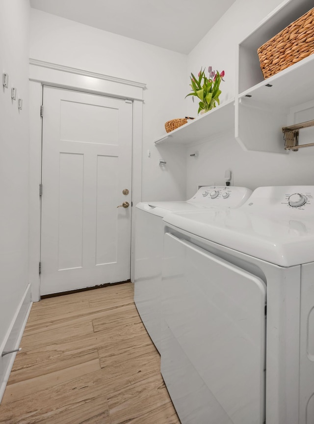 7106 Pepper Tree Cir, Fairview, TN 37062 - laundry room featuring separate washer and dryer and light wood-type flooring