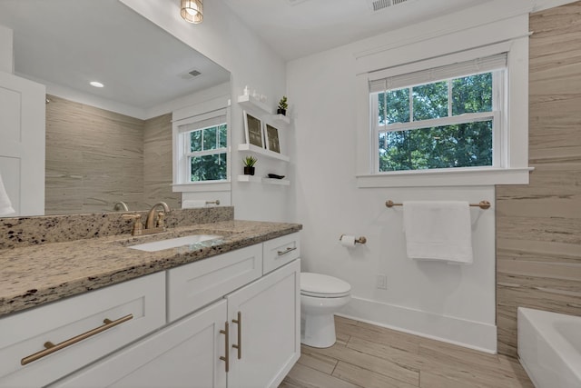 7106 Pepper Tree Cir, Fairview, TN 37062 - bathroom featuring vanity, a bathtub, wood finished floors, a shower, and recessed lighting