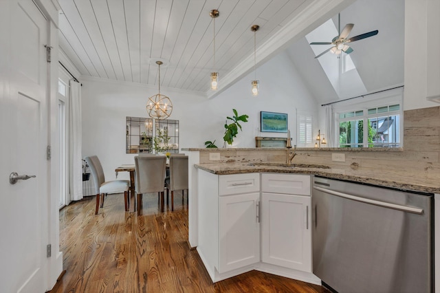 7106 Pepper Tree Cir, Fairview, TN 37062 - kitchen with stainless steel dishwasher, white cabinets, light stone countertops, hanging light fixtures, and vaulted ceiling