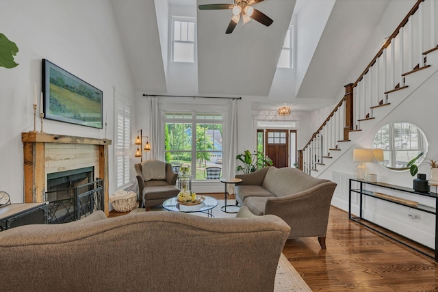 7106 Pepper Tree Cir, Fairview, TN 37062 - living area featuring high vaulted ceiling, a fireplace, stairway, light wood-style flooring, and a ceiling fan