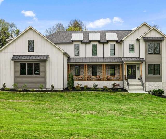 9409 Clovercroft Rd, Franklin, TN 37067 - modern inspired farmhouse with a standing seam roof, a shingled roof, board and batten siding, covered porch, and a front lawn