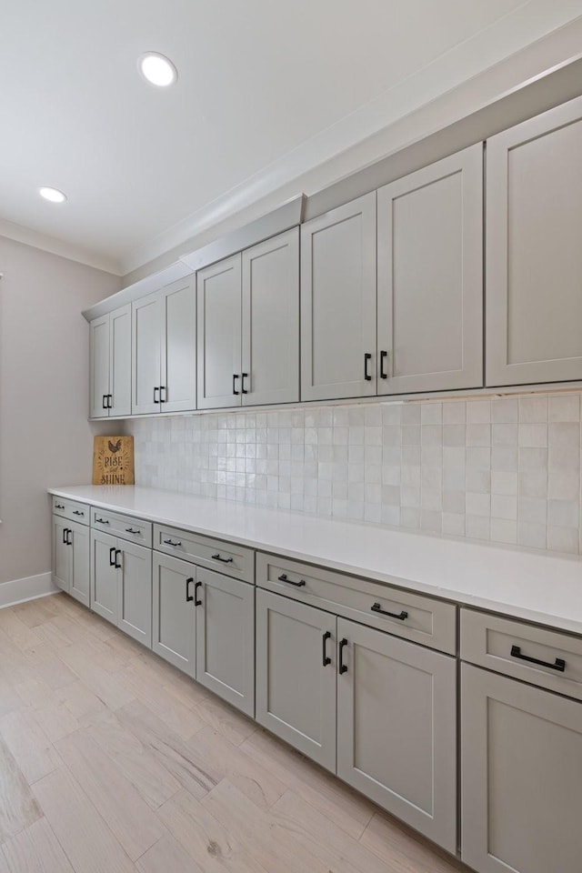9409 Clovercroft Rd, Franklin, TN 37067 - kitchen with gray cabinets, light countertops, backsplash, and recessed lighting