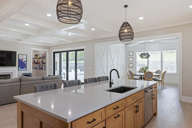 9409 Clovercroft Rd, Franklin, TN 37067 - kitchen with light wood-style flooring, stainless steel dishwasher, beamed ceiling, a kitchen island with sink, and open floor plan