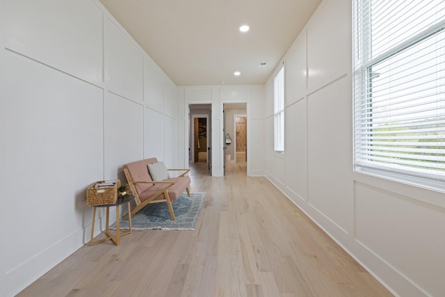 9409 Clovercroft Rd, Franklin, TN 37067 - corridor featuring light wood-type flooring, a decorative wall, and recessed lighting