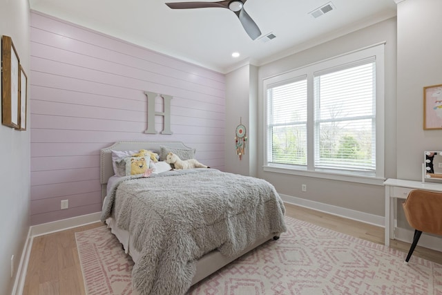 9409 Clovercroft Rd, Franklin, TN 37067 - bedroom featuring light wood-style flooring, crown molding, wooden walls, and a ceiling fan