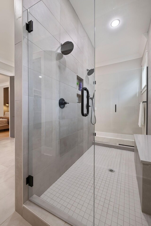 9409 Clovercroft Rd, Franklin, TN 37067 - bathroom featuring a stall shower, tile patterned floors, and recessed lighting