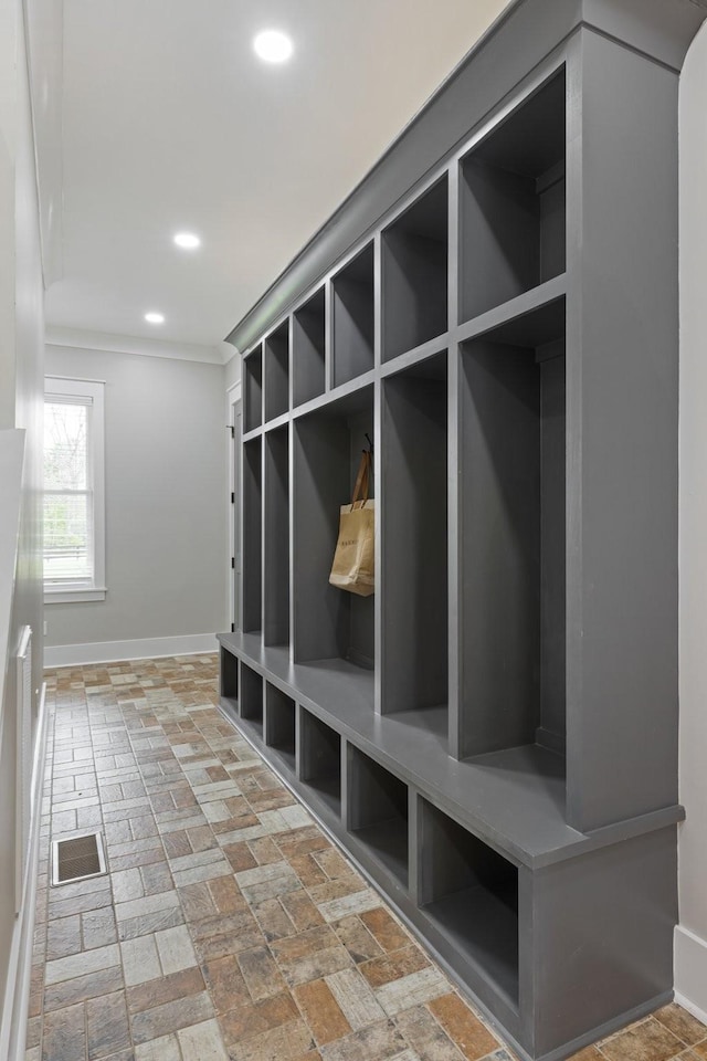 9409 Clovercroft Rd, Franklin, TN 37067 - mudroom with recessed lighting, crown molding, and brick floors