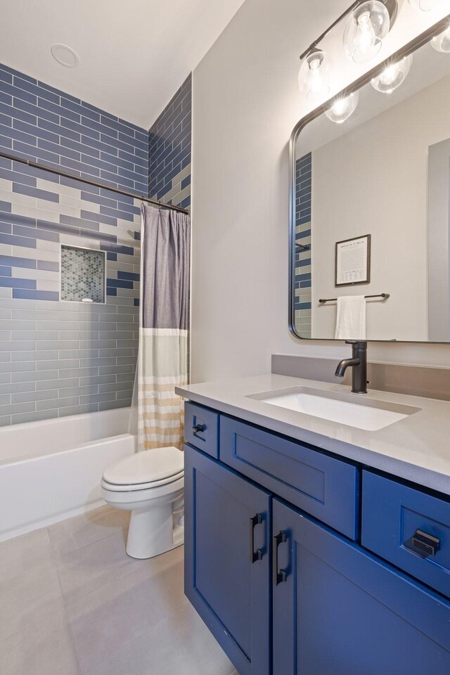 9409 Clovercroft Rd, Franklin, TN 37067 - bathroom featuring vanity, tile patterned floors, and shower / bath combo with shower curtain