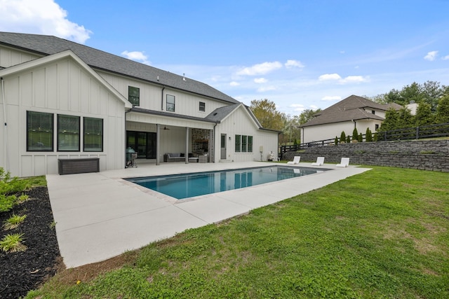 9409 Clovercroft Rd, Franklin, TN 37067 - back of property with board and batten siding, a patio area, ceiling fan, and a shingled roof
