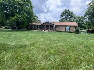 1246 Imperial Dr, Columbia, TN 38401 - rear view of house featuring a yard