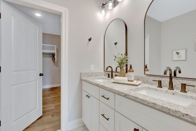 1268 S Tidwell Rd, Bon Aqua, TN 37025 - bathroom with double vanity and a spacious closet