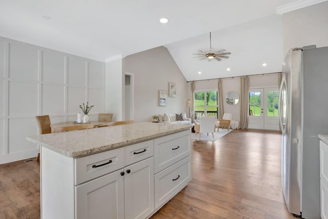 1268 S Tidwell Rd, Bon Aqua, TN 37025 - kitchen with freestanding refrigerator, open floor plan, light wood-type flooring, ceiling fan, and lofted ceiling